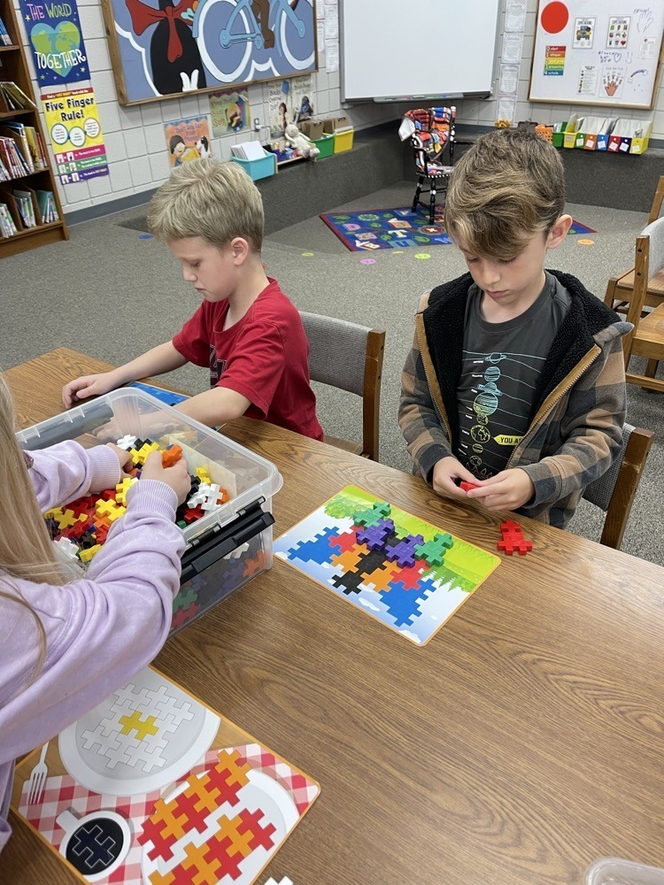Claremont students playing with S.T.E.M bins at the library.