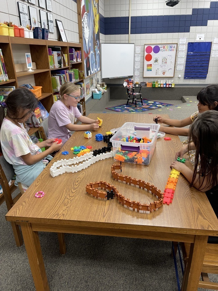Claremont students playing with S.T.E.M bins at the library.