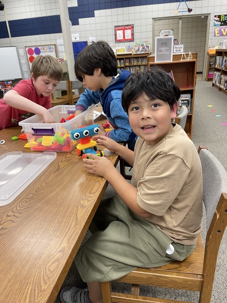 Claremont students playing with S.T.E.M bins at the library.