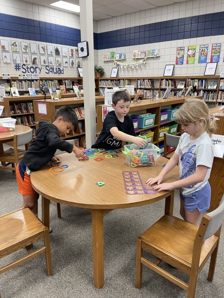 Claremont students playing with S.T.E.M bins at the library.