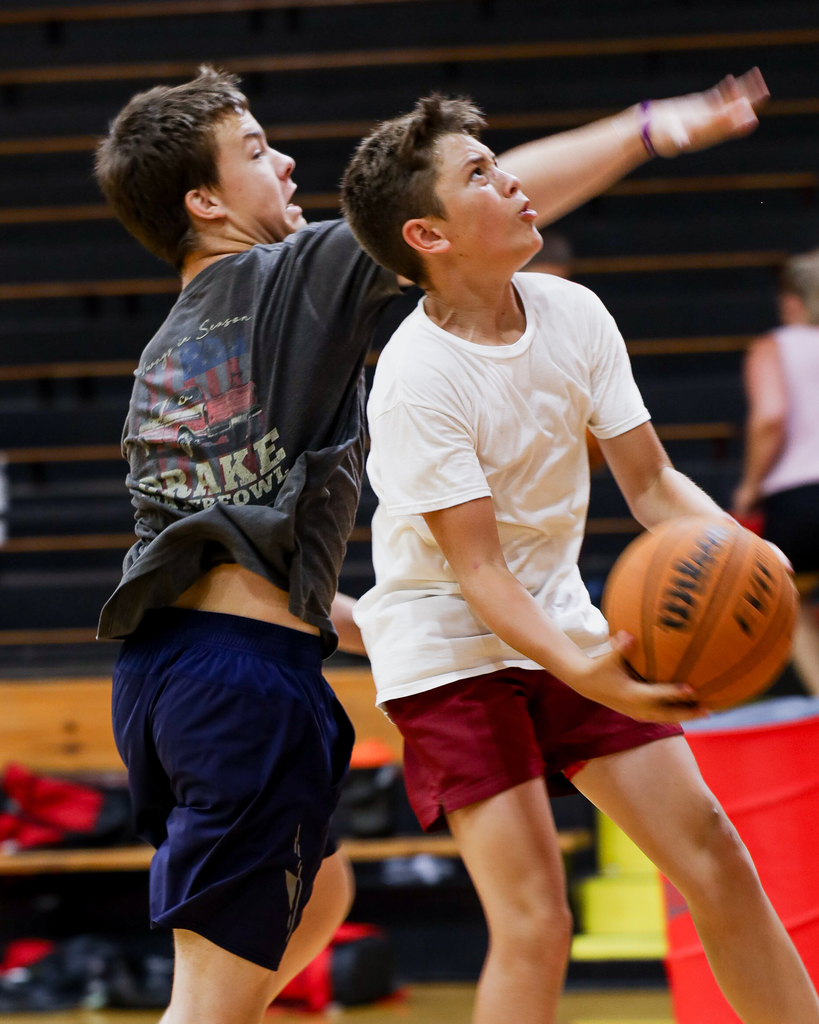 Basketball Campers play one on one.