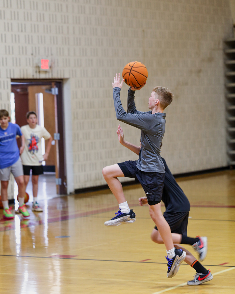 Basketball Campers play one on one.