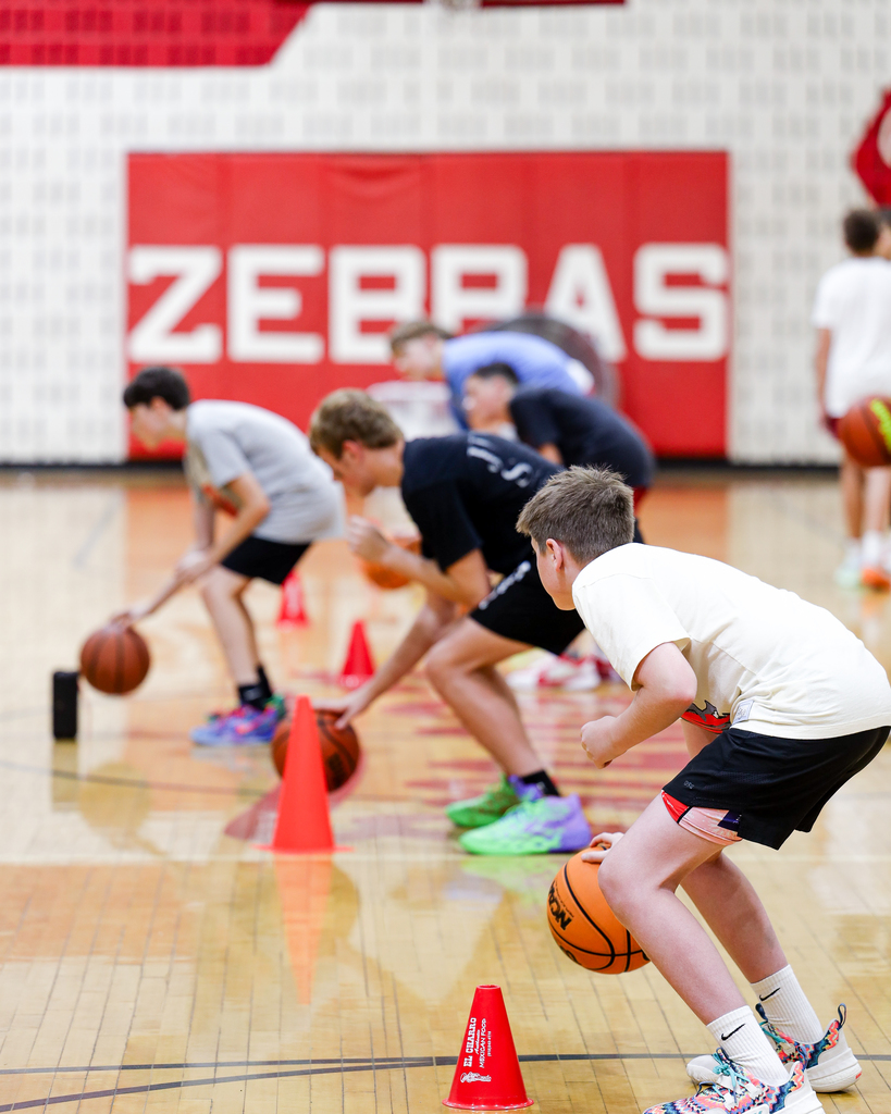 Basketball Campers run drills.