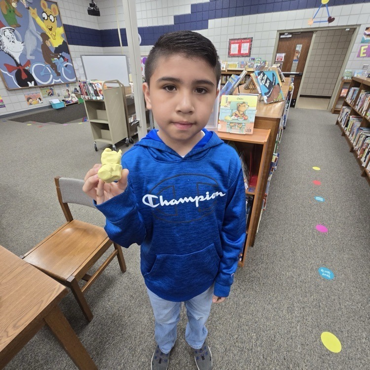 student with playdough creatures