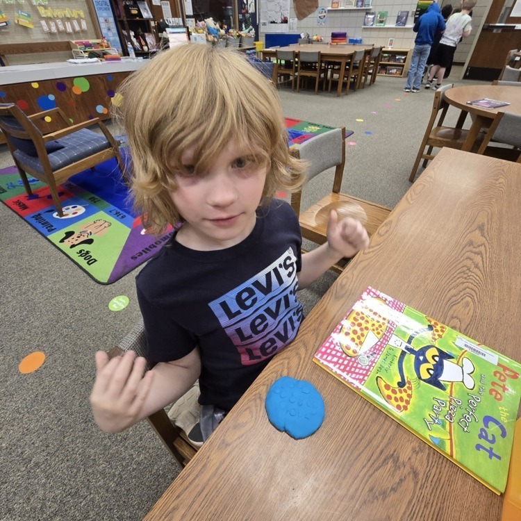 student with playdough creatures