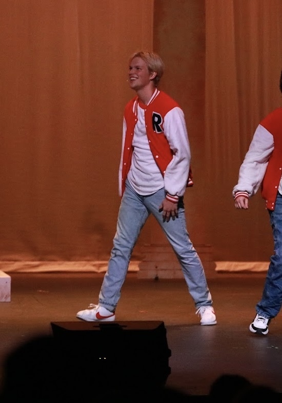 student performing in heathers the musical
