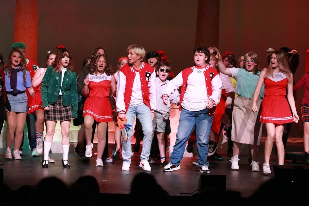 student performing in heathers the musical