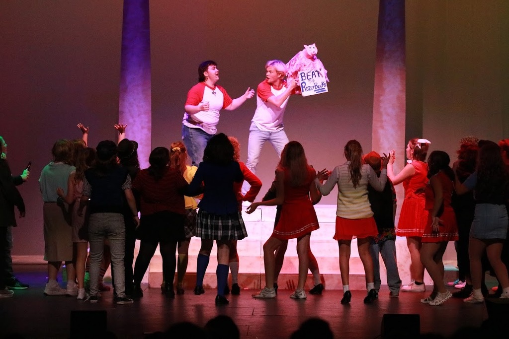 student performing in heathers the musical