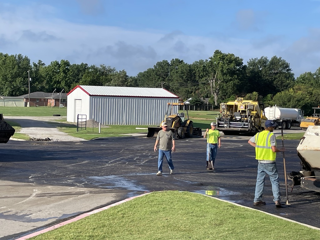 community members putting in new asphalt