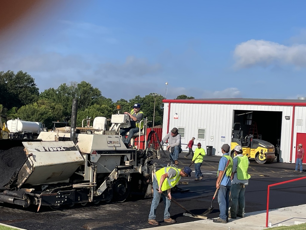 community members putting in new asphalt