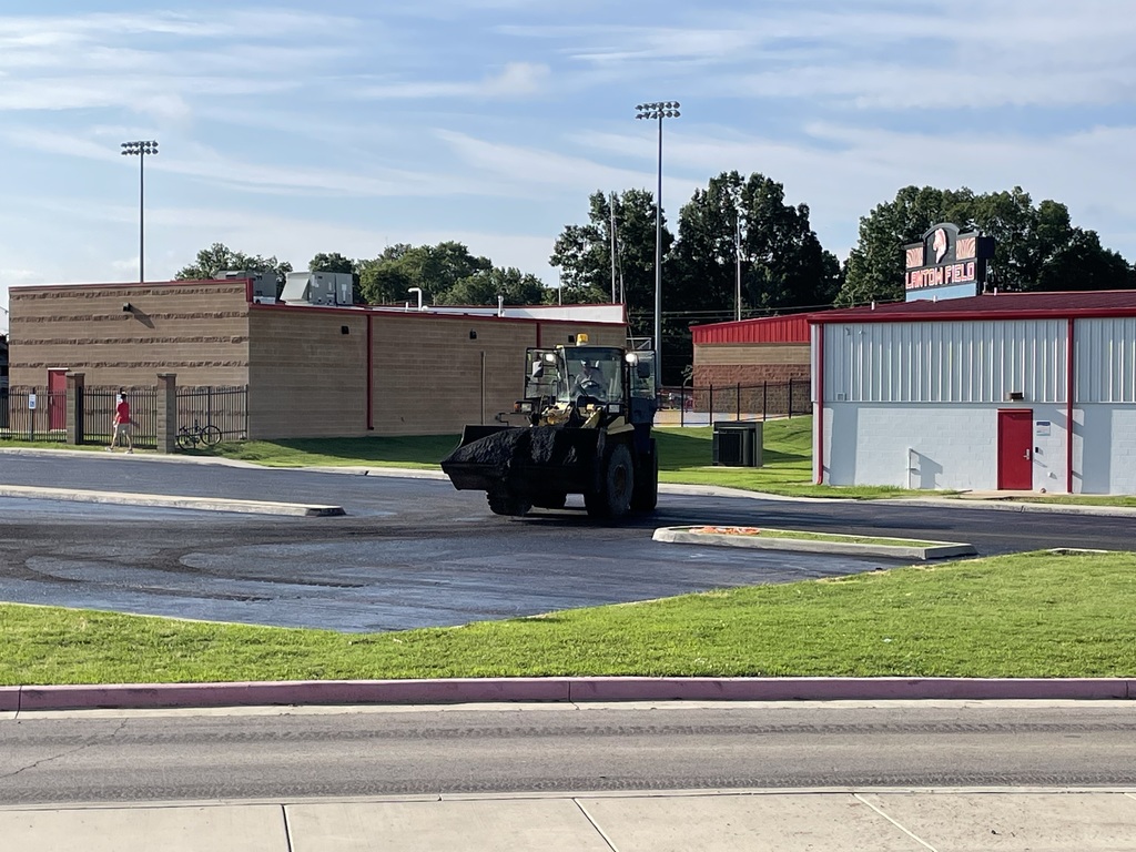 community members putting in new asphalt
