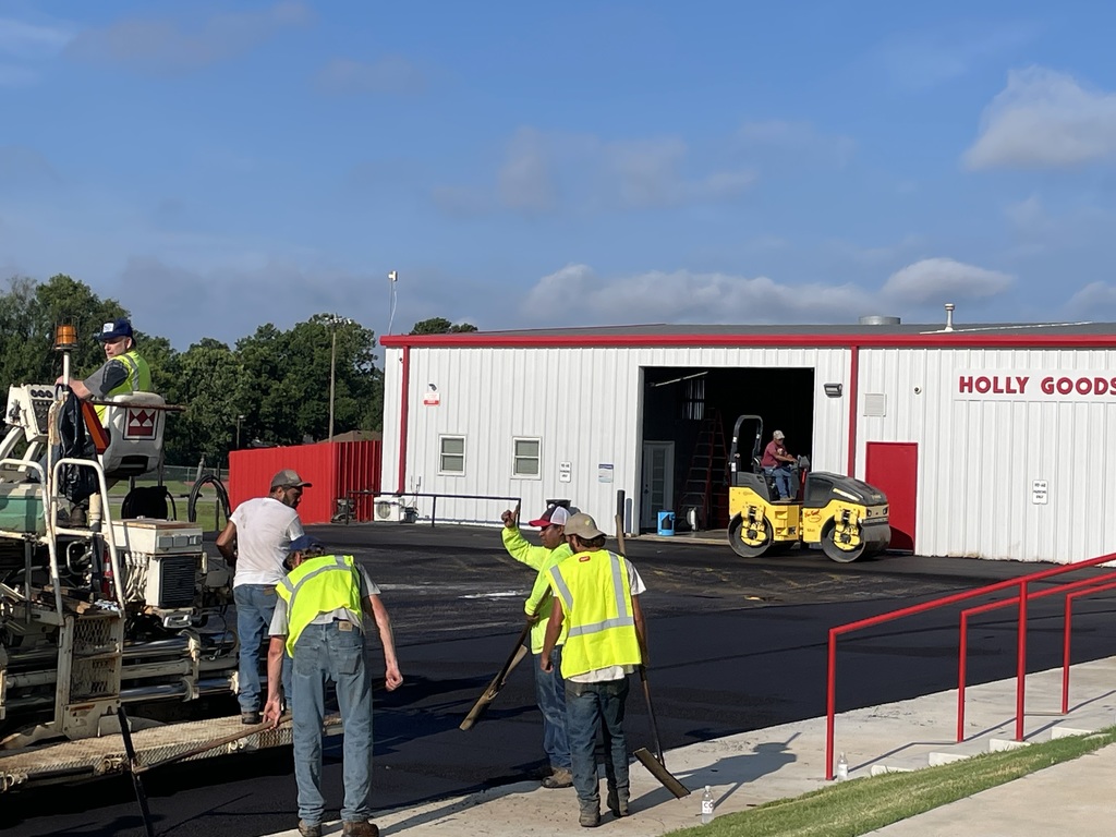 community members putting in new asphalt
