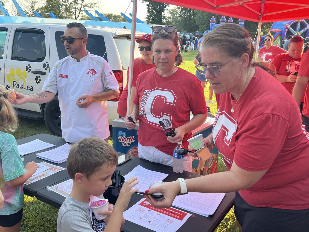 Zebra Nutrition staff handing out food at National Night Out