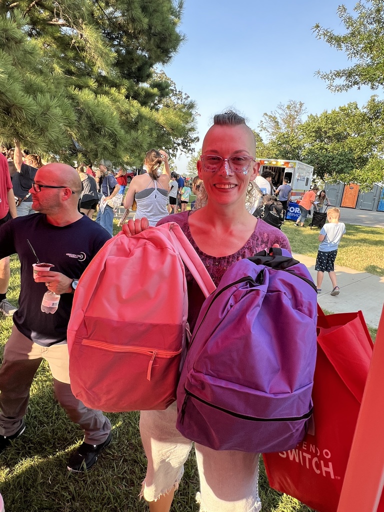 Community member with her free backpacks
