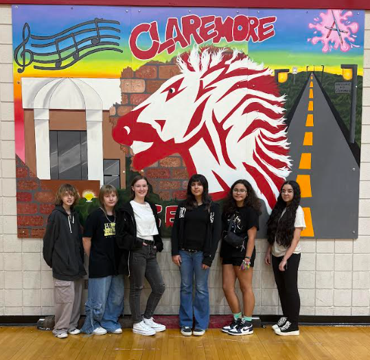 WRJH art students in front of their work