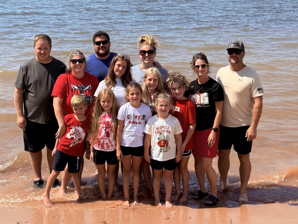 zebra family on the lake