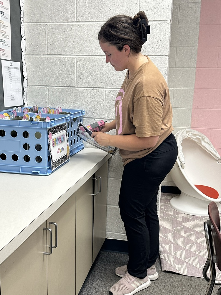 teacher preparing room for students 