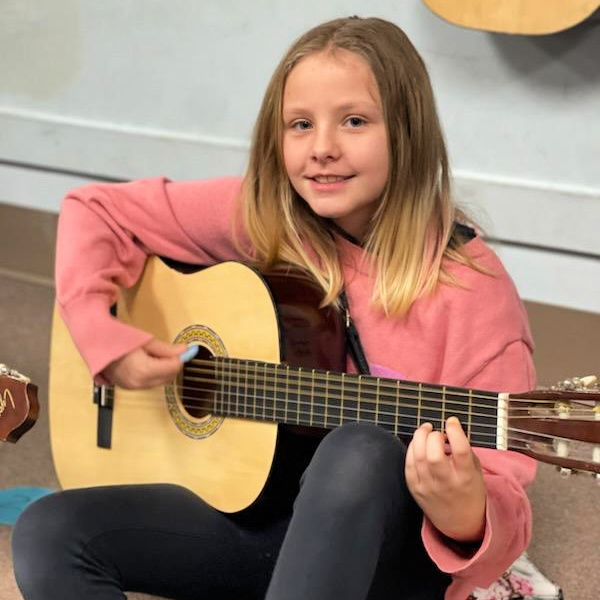 Student playing an instrument