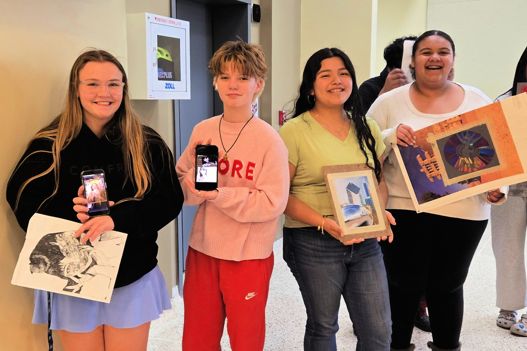 art students showing their creations