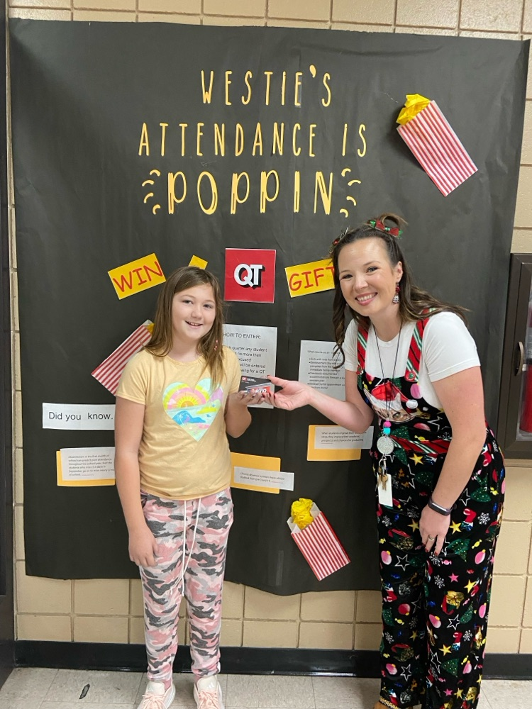 Lyons and student holding gift card