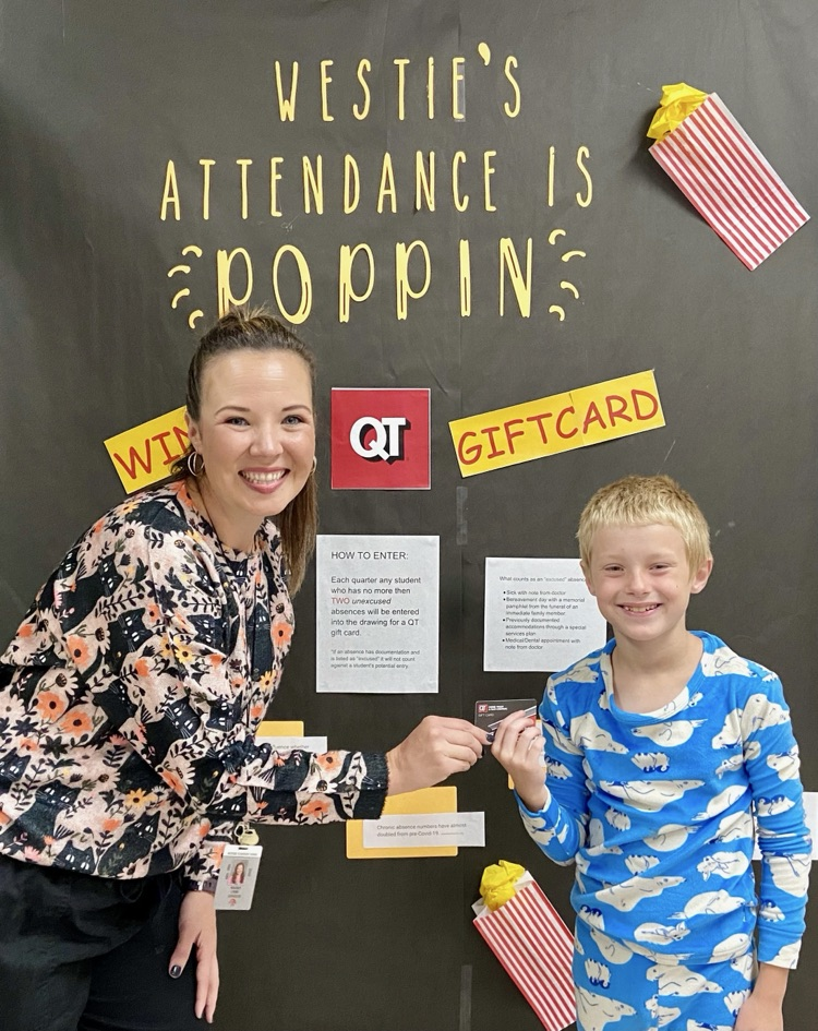 Lyons and student holding gift card