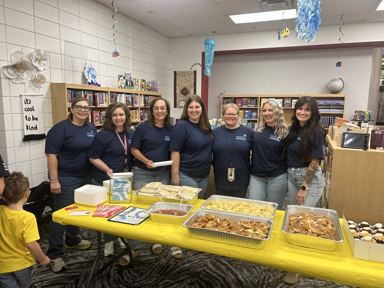 teachers in front of breakfast 