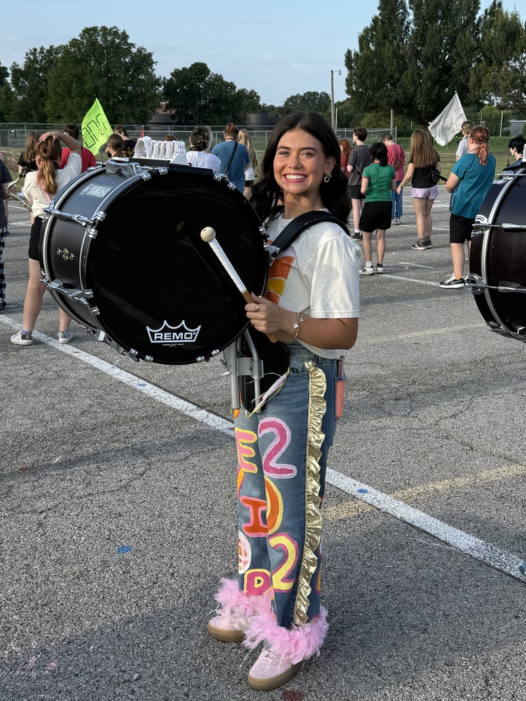 Band student dressed up for the first day of school at marching rehearsal 