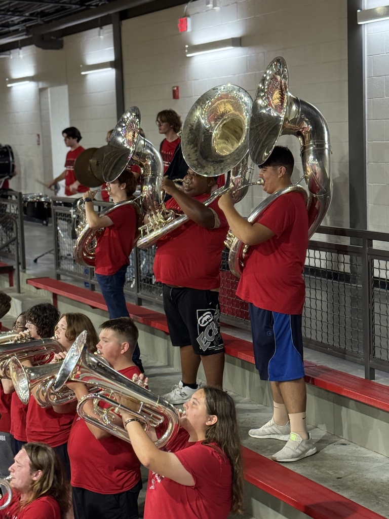 Tubas playing at the assembly