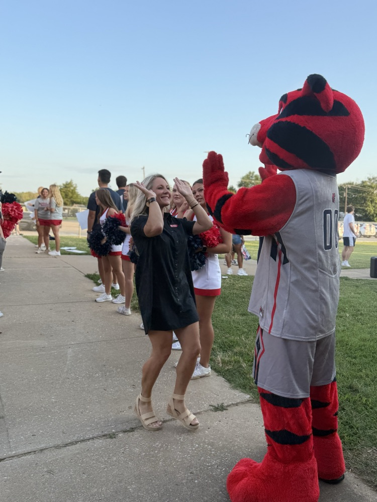 principal giving high five