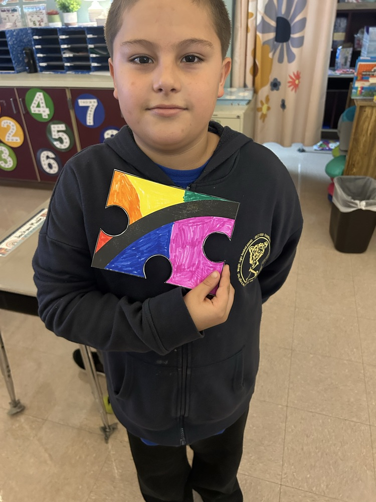 student with colored puzzle piece 