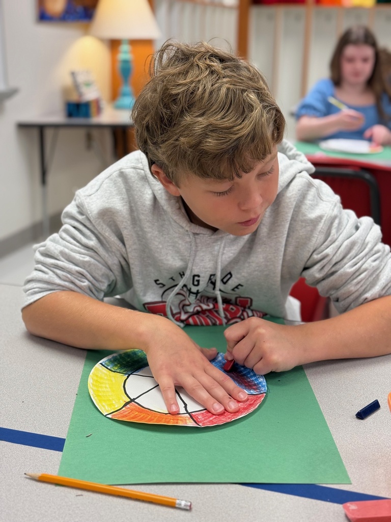 student working hard on his color wheel
