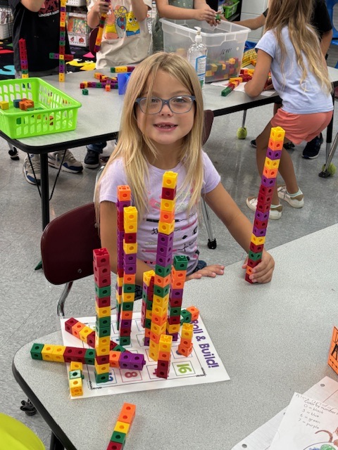 students playing with number blocks 