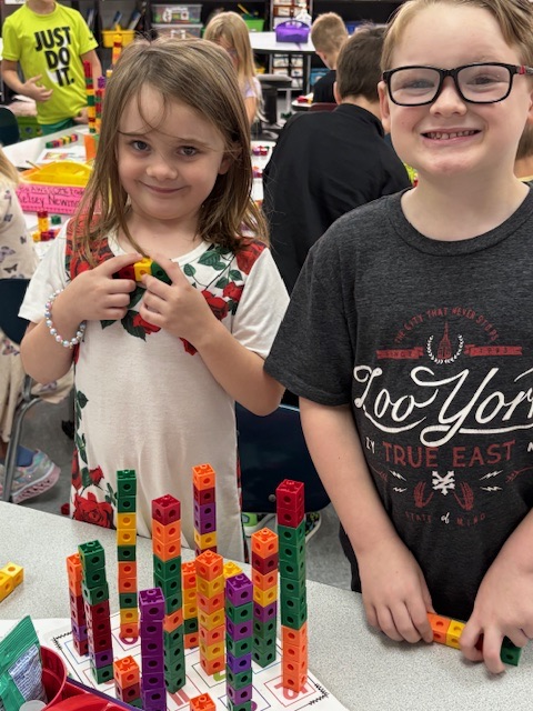students playing with number blocks 