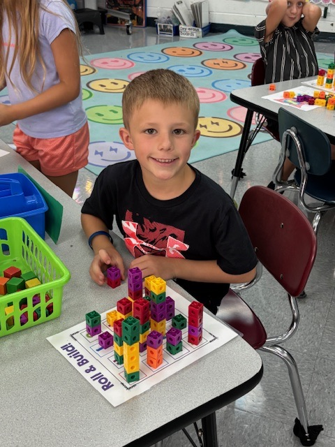 students playing with number blocks 