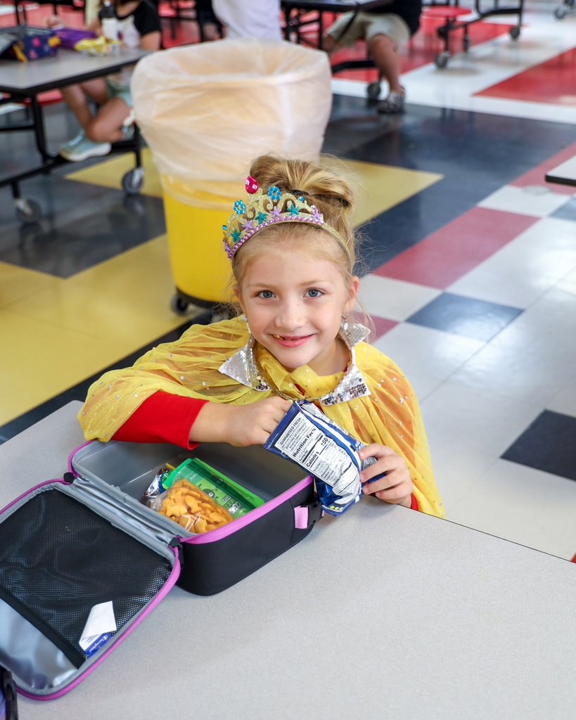 Elementary student dressed as princess.