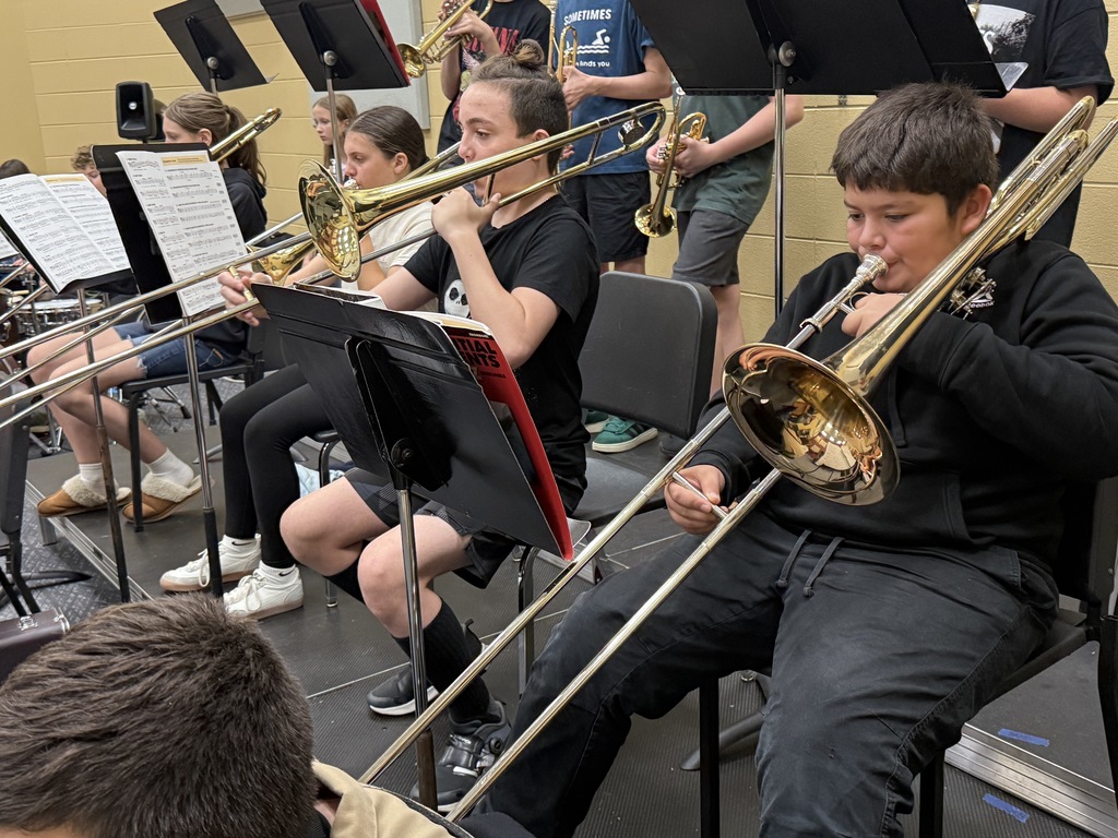 Trombone players working on their skills