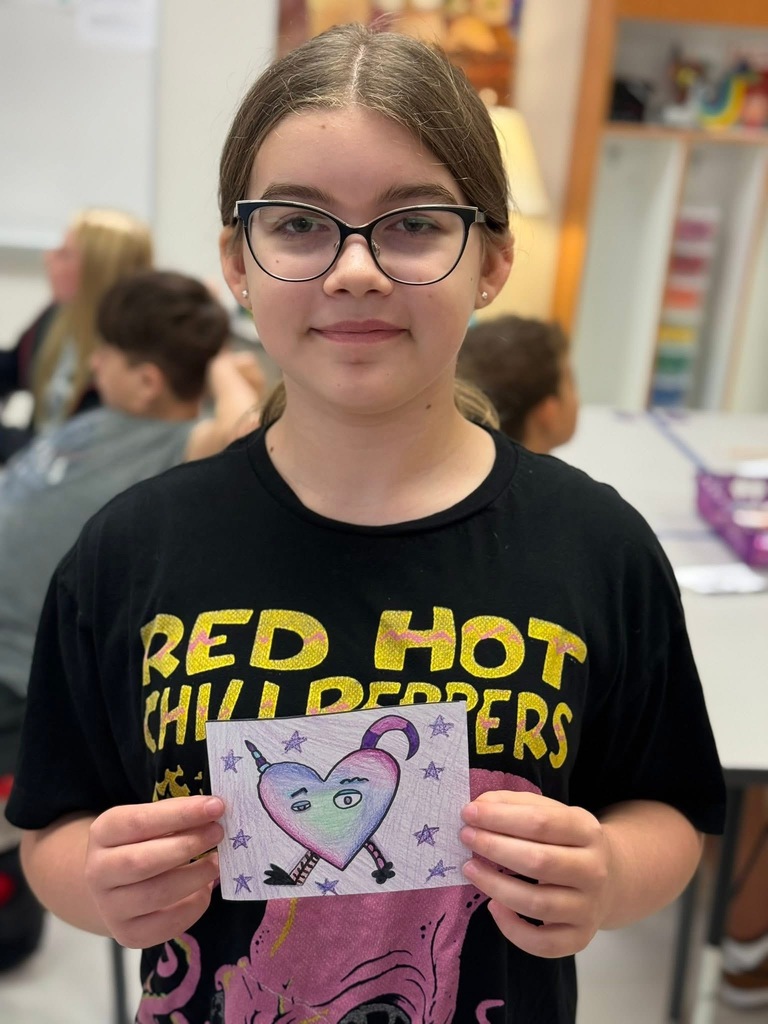Student with their art work
