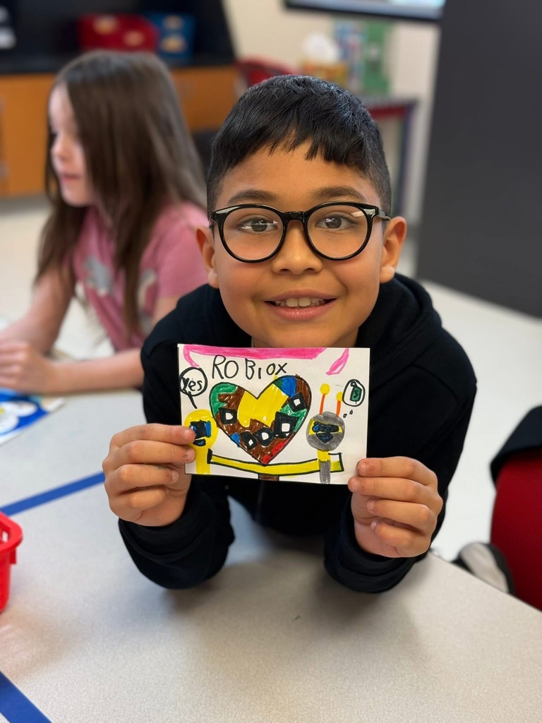student smiling with Roblox heart