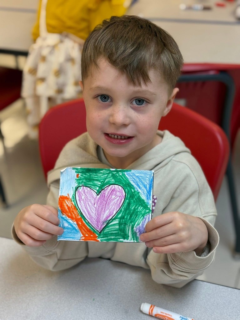 Student with heart they drew