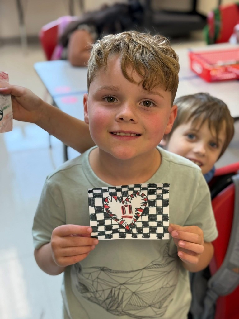 Student with their art work