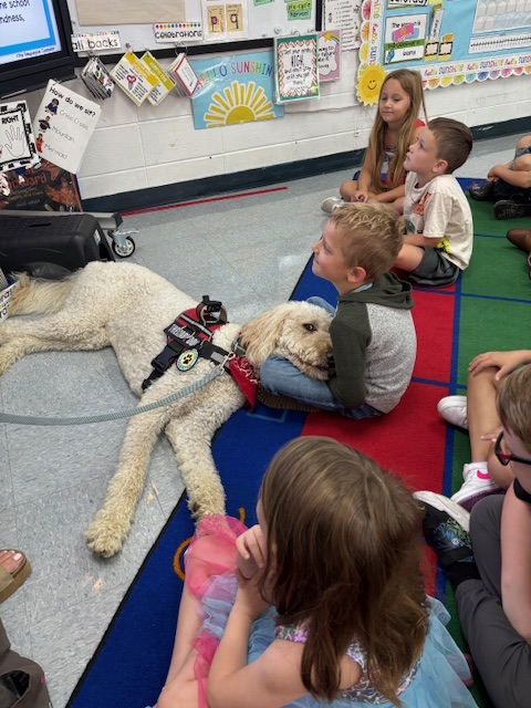 Maverick with student 