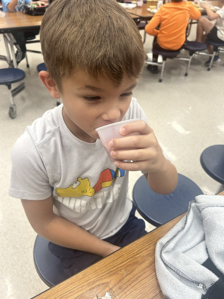 student trying smoothie