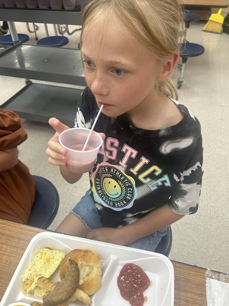 student trying smoothie