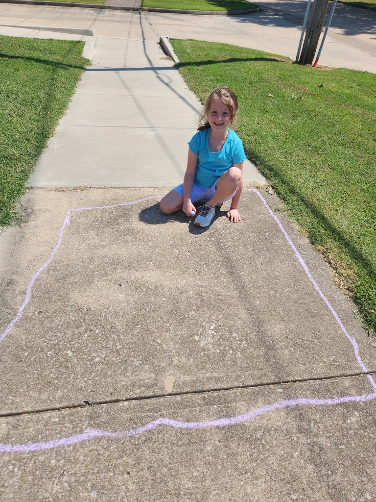 students playing with chalk outside