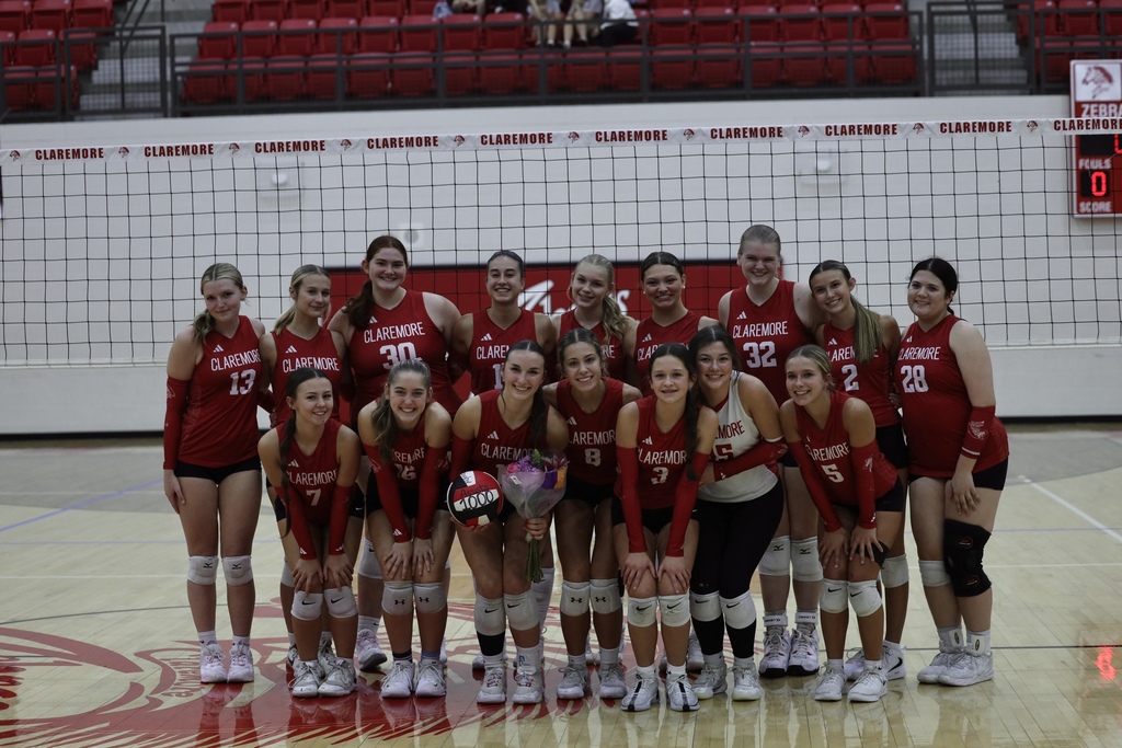 Volleyball team picture on the court with Grace 