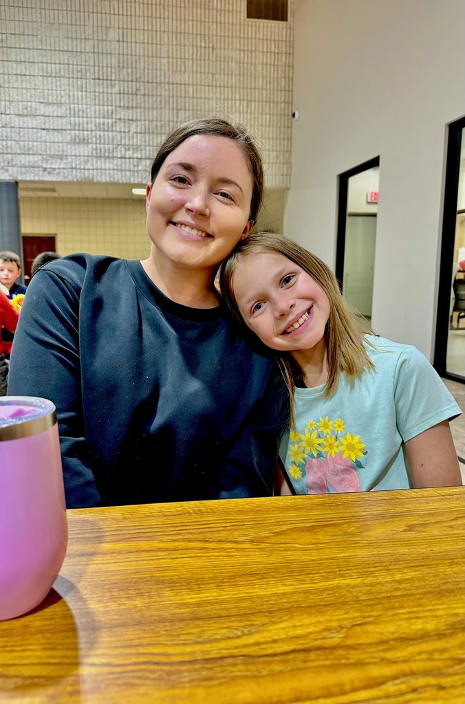 teacher and students at lunch