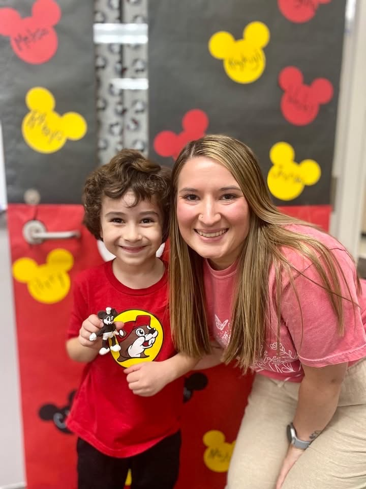 teacher hugging student