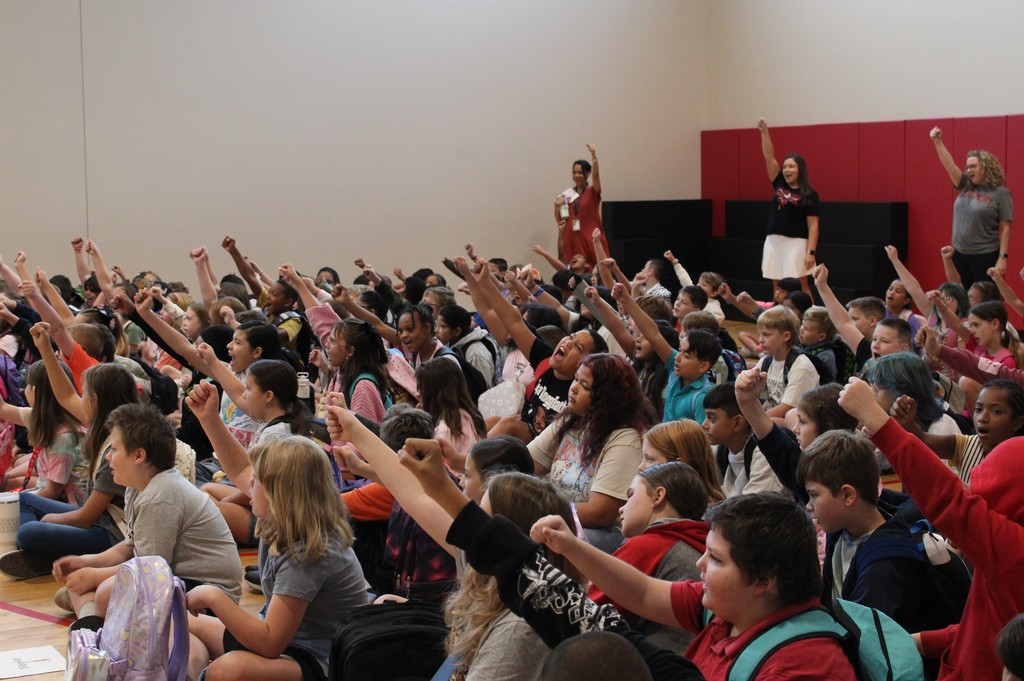 students raising fists for the Claremont song