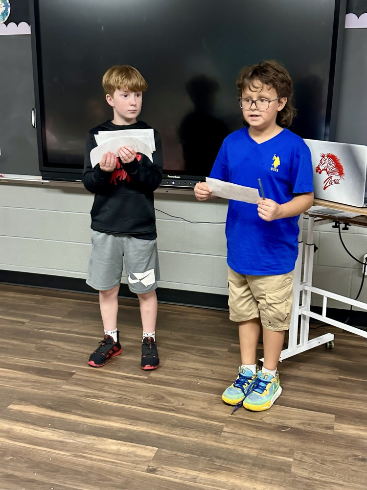 students standing and speaking 
