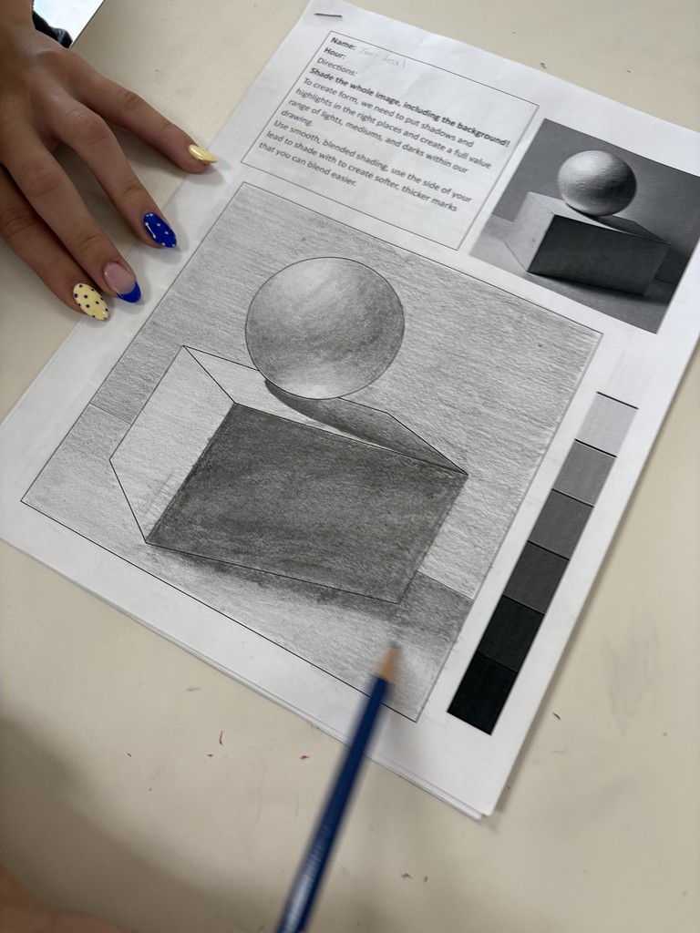 Student working on shading of 3D shapes